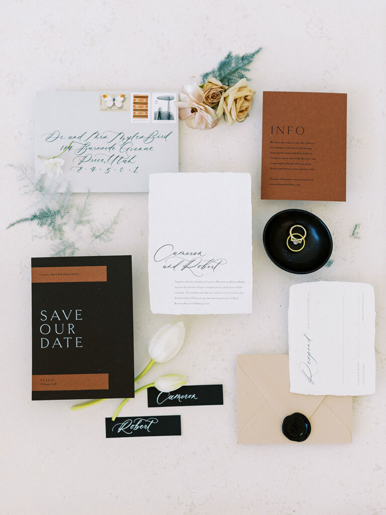 Brown and black wedding invitition suite at Modern Mountain Wedding by Destination Wedding Planner Britt Warnick | How to Balance Masculine and Feminine Energy in Your Wedding Decor | Winter Utah Wedding at River Bottoms Ranch